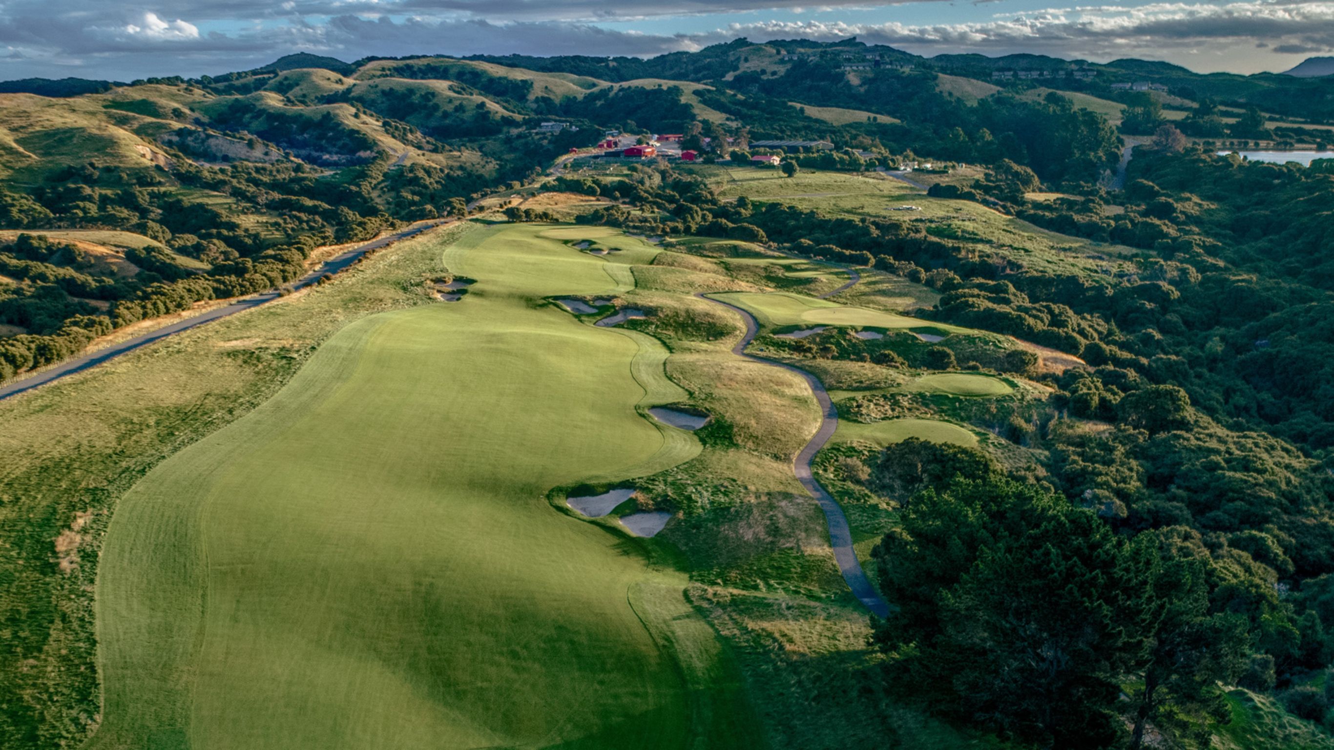 Aerial view over the fairway up towards to farm